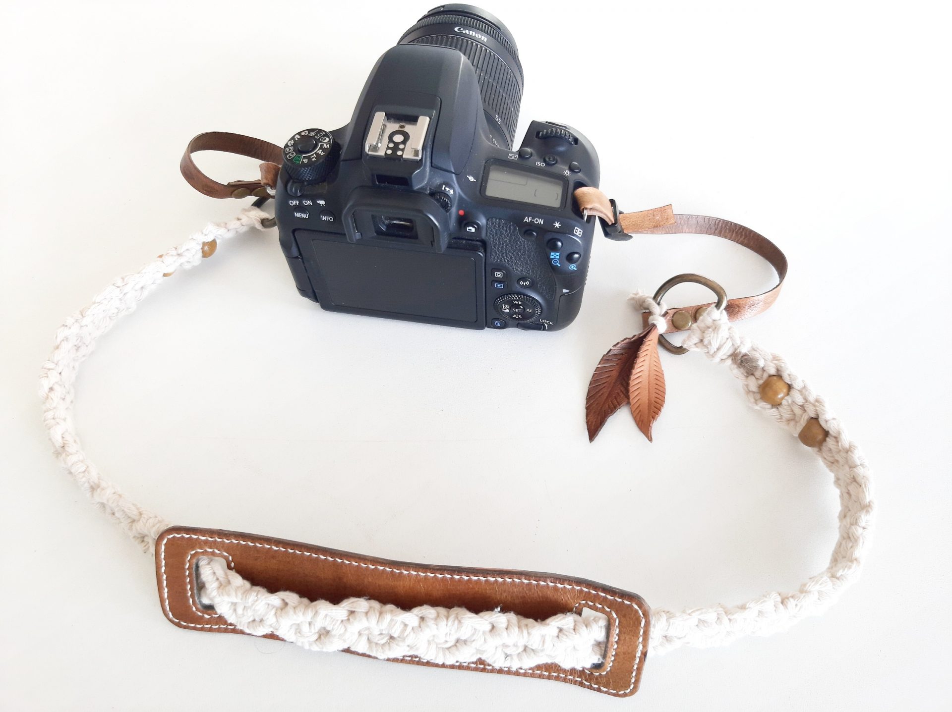 Leather and macramé shoulder camera strap.